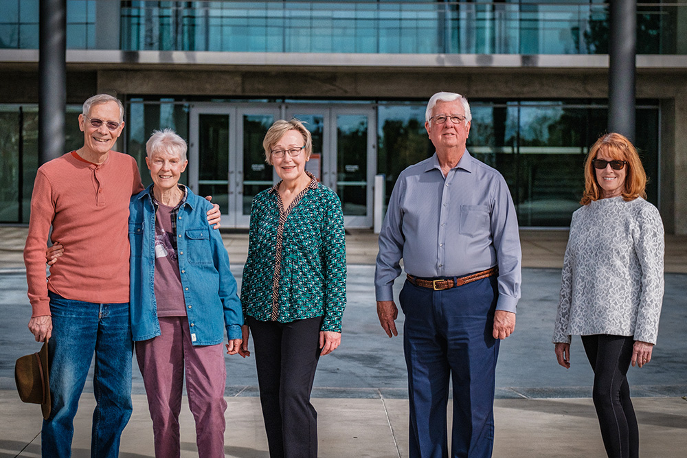 A group of OLLI Learners stand in front of the Broome Library at CSUCI