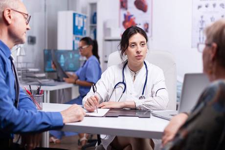 A nurse taking prescribing medicines for the patient